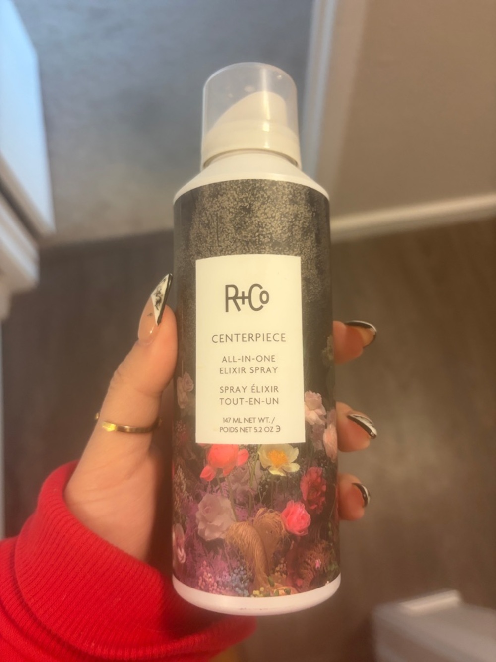 R+Co Centerpiece All-In-One Elixir Spray — White Bottle with Floral Design